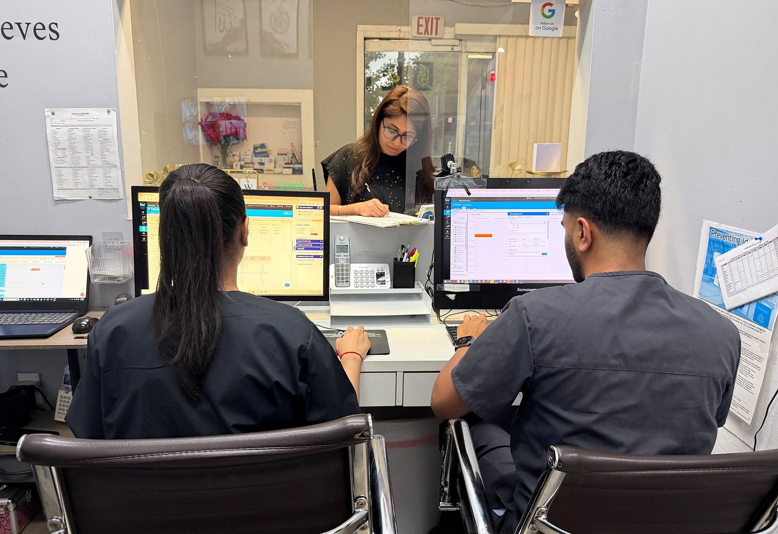 Family Medical Health Care staff assisting patients at the front desk